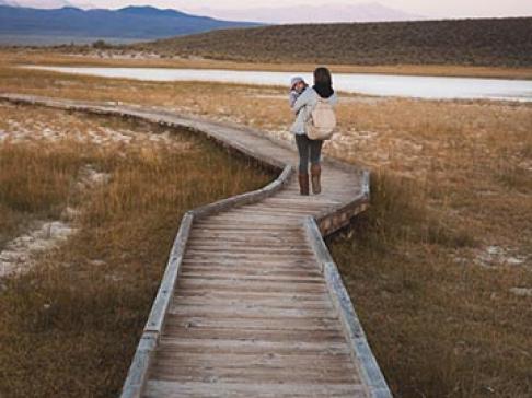 Mom walking down a long path